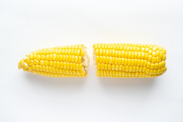 Close Up of raw corn on white background.