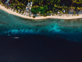 Fototapeta na wymiar Tropical island with sandy beach and turquoise ocean. Aerial view.
