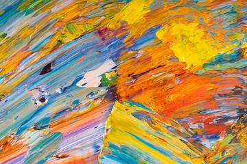 Bright, juicy, multi-colored abstraction of their mixing of oil paints on a palette close-up.