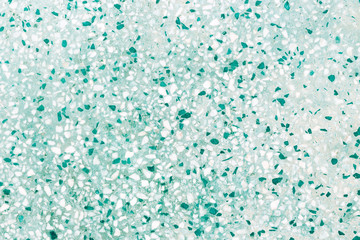 Aquamarine terrazzo background, turquoise and white pieces, toned