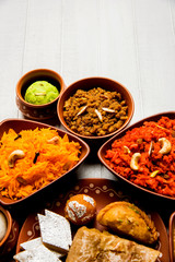 group of Indian Sweet / mithai in terracotta bowl
