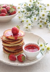 Pancakes with strawberry syrup