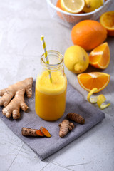 Detox drink with turmeric or curcuma and ginger, healthy detox vitamin orange juice