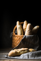Fresh baguettes in wicker basket