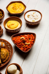 group of Indian Sweet / mithai in terracotta bowl