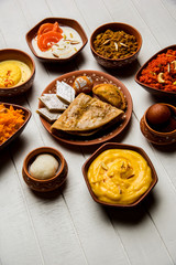 group of Indian Sweet / mithai in terracotta bowl