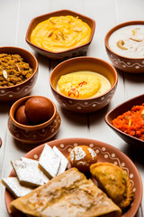 group of Indian Sweet / mithai in terracotta bowl