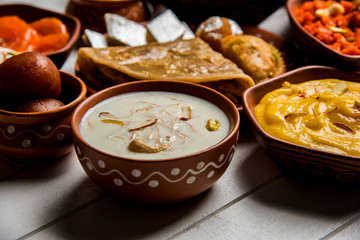 group of Indian Sweet / mithai in terracotta bowl