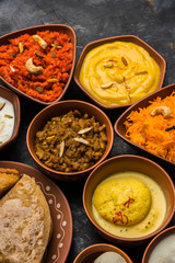 group of Indian Sweet / mithai in terracotta bowl