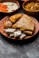 group of Indian Sweet / mithai in terracotta bowl
