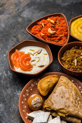 group of Indian Sweet / mithai in terracotta bowl