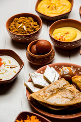 group of Indian Sweet / mithai in terracotta bowl