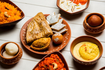 group of Indian Sweet / mithai in terracotta bowl