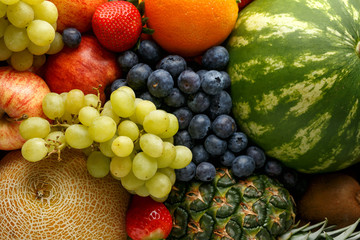 Naklejka na ściany i meble Variety of fresh fruits and berries in wooden box. Healthy vegetarian summer food