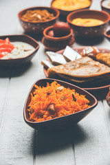 group of Indian Sweet / mithai in terracotta bowl