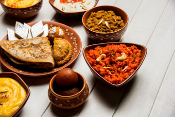 group of Indian Sweet / mithai in terracotta bowl