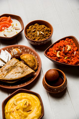 group of Indian Sweet / mithai in terracotta bowl