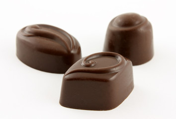 chocolate candies on white background