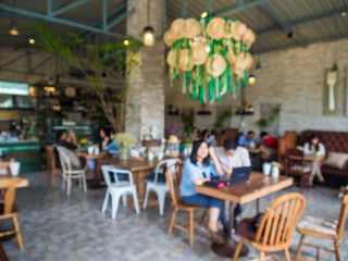 Blurred indoor coffee shop with busy people