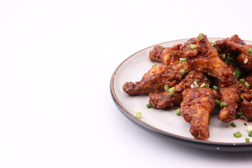 Delicious Korean fried chicken on a white background.