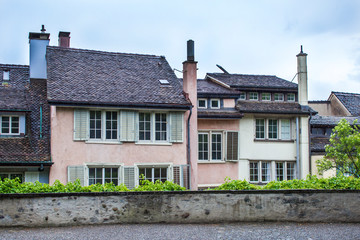 Zurich architecture. The facade of the house. Windows with shutters. Zurich Streets
