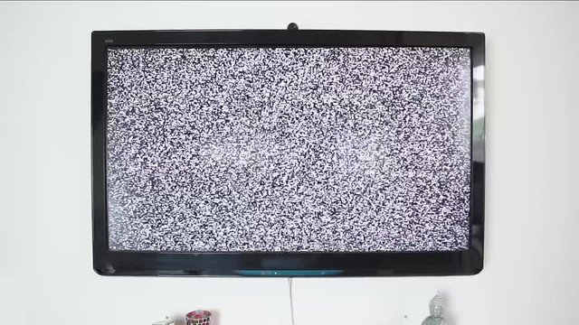 Modern TV with noise, glitch. LCD out of order, ruined television static, digital error, zoom out.
