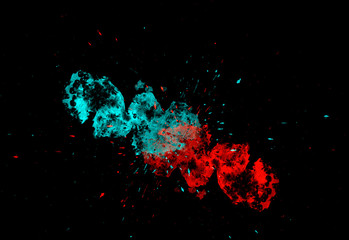 Freeze motion of colorful paint explosion on black background.