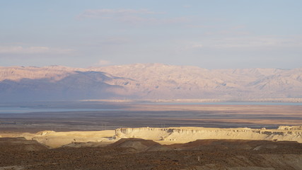 Landscape with desert and Dead Sea in Israel at sunset.