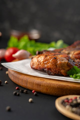 hot roasted barbecued beef steak with red sauce, onion and spice, lettuce leafs