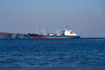 Ship cargo ship on the background of the seascape