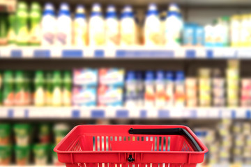 Abstract blurred photo of store with basket in department store bokeh background. business concept.