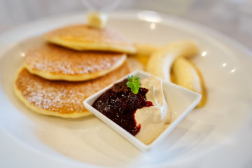 pancakes on a plate of fruit
