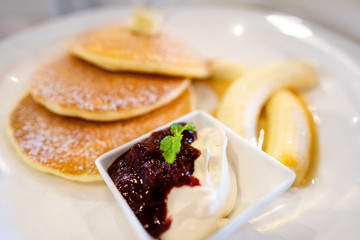 pancakes on a plate of fruit