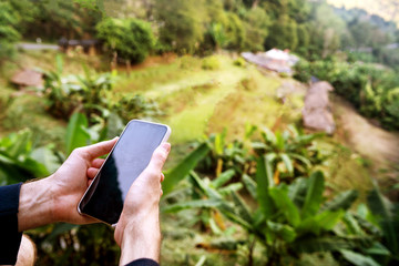 freelance guy in the tropics working on the phone