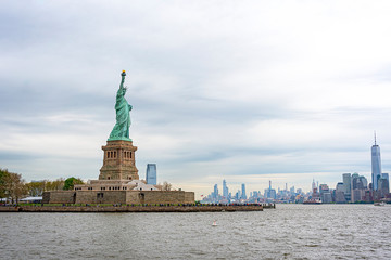 USA, New York - May 2019: Statue of Liberty, Liberty Island, with Manhtattan in the background