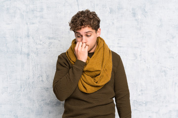 Blonde man over grunge wall having doubts