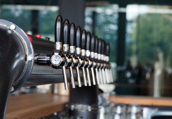 Craft beer tap system on the bar counter 