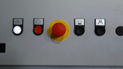 Plastic red stop button for industrial process with others buttons