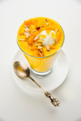 Falooda / Faluda is a popular Indian dessert - Strawberry and Mango flavoured which has Ice cream, noodles, sweet basil seeds and nuts, selective focus