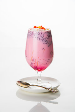 Falooda / Faluda is a popular Indian dessert - Strawberry and Mango flavoured which has Ice cream, noodles, sweet basil seeds and nuts, selective focus