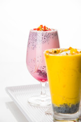 Falooda / Faluda is a popular Indian dessert - Strawberry and Mango flavoured which has Ice cream, noodles, sweet basil seeds and nuts, selective focus