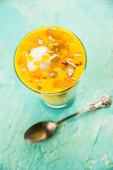 Falooda / Faluda is a popular Indian dessert - Strawberry and Mango flavoured which has Ice cream, noodles, sweet basil seeds and nuts, selective focus