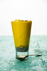 Falooda / Faluda is a popular Indian dessert - Strawberry and Mango flavoured which has Ice cream, noodles, sweet basil seeds and nuts, selective focus