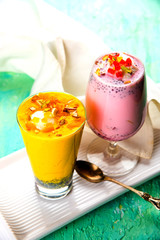 Falooda / Faluda is a popular Indian dessert - Strawberry and Mango flavoured which has Ice cream, noodles, sweet basil seeds and nuts, selective focus