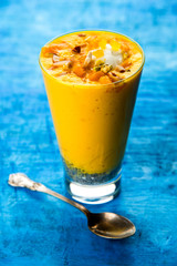 Falooda / Faluda is a popular Indian dessert - Strawberry and Mango flavoured which has Ice cream, noodles, sweet basil seeds and nuts, selective focus
