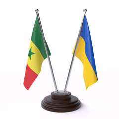 Senegal and Ukraine, two table flags isolated on white background. 3d image