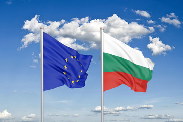 European Union vs Bulgaria. Thick colored silky flags of European Union and Bulgaria. 3D illustration on sky background. - Illustration