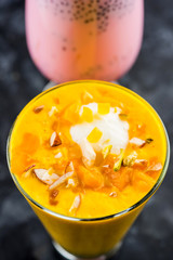 Falooda / Faluda is a popular Indian dessert - Strawberry and Mango flavoured which has Ice cream, noodles, sweet basil seeds and nuts, selective focus