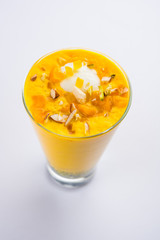 Falooda / Faluda is a popular Indian dessert - Strawberry and Mango flavoured which has Ice cream, noodles, sweet basil seeds and nuts, selective focus