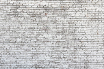 Old wall made of red brick, painted white in loft style for modern designer interior of room, bar or restaurant